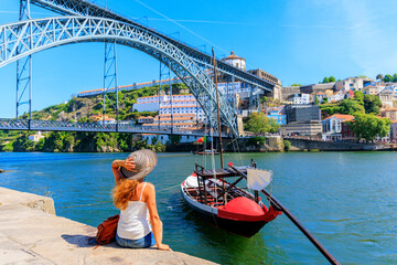 Traveler woman enjoying gondola boat in Douro river- Porto,  Portugal