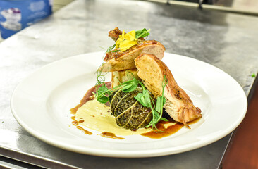 Chef working in busy kitchen preparing meals