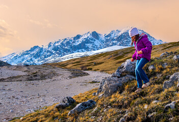 little girl hiking in scenic mountains of Abruzzo - Gran Sasso National Park in Italy - hike kids 