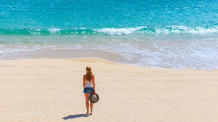 woman alone on tropical beach- vacation, travel, freedon concept