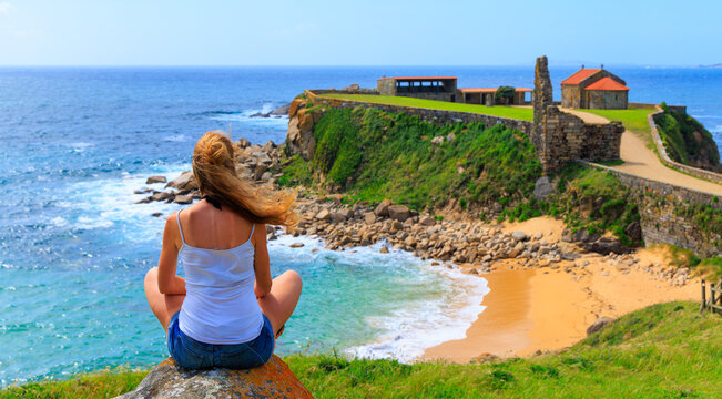 Traveler woman in Galicia- tourism in Spain,  Pontevedra,  ermita da Nosa Senora da Lanzada,  Sanxenxo