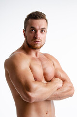 Fototapeta premium Fitness and healthy lifestyle. Young attractive man with a beautiful body.