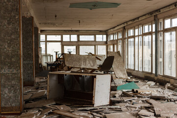 The ruins of furniture in an abandoned administrative building