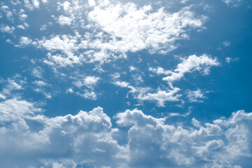 Blue sky with white fluffy clouds. Cumulus clouds background. Cloudscape morning sky. The concepts of freedom of live, never give up and positive though energy.