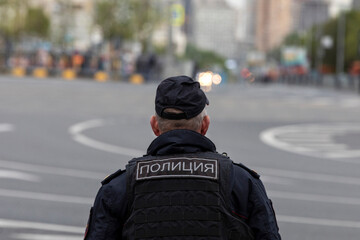 A police officer monitors law and order in the center of Moscow, Russia