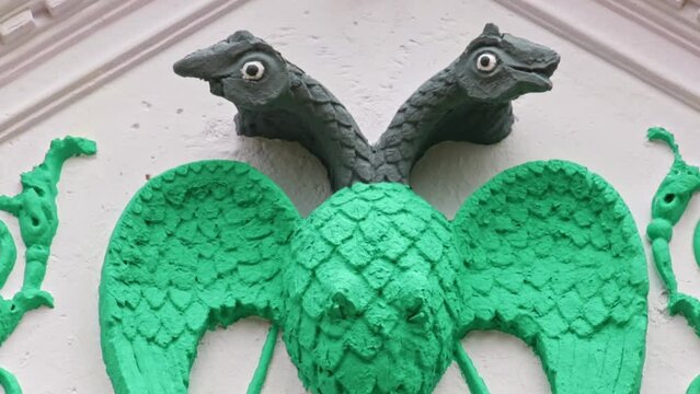 A closeup of a two-headed bird sculpture, or gandaberunda bird emblem