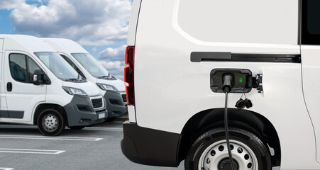 Electric delivery van with connected charging cable.	