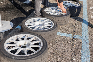 Inflating a Set of Tires Placed on the Ground of a Grand Touring Competition Car Engine