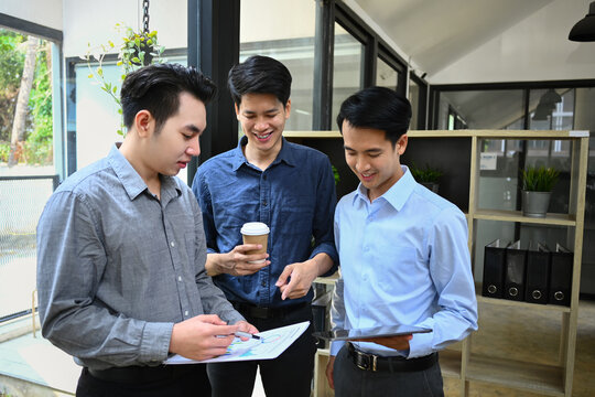 Image of business team discussing startup project, sharing business ideas during coffee break