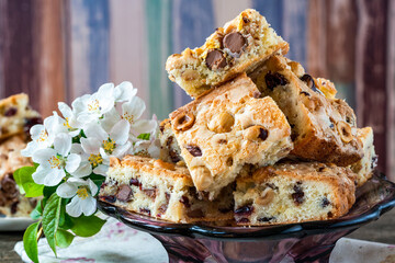 Easter mini chocolate egg traybake with hazelnuts and cranberries cut into squares