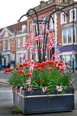 Red tulips and Union Jack bunting flowers on the street