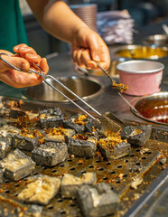 Stinky tofu or Smelly tofu, traditional Chinese street food, food in Changsha - obrazy, fototapety, plakaty