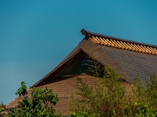 Fototapeta na wymiar roof canopy with red copper cladding, made in classic Japanese style