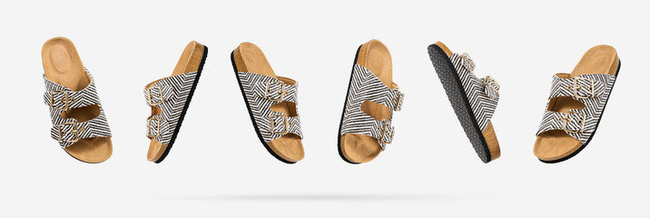 Summer Vegan cork sandals with straps floating from different sides on light gray background....