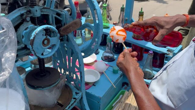 footage of making Indian Ice Gola Dish, Ice Popsicle 4K, Street Food. Summer special.