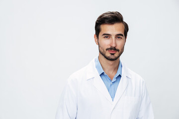 Man doctor in white coat looking into camera on white isolated background, copy space, space for text, health