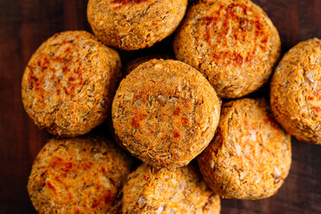 Portion of fresh vegetarian falafels on wooden board