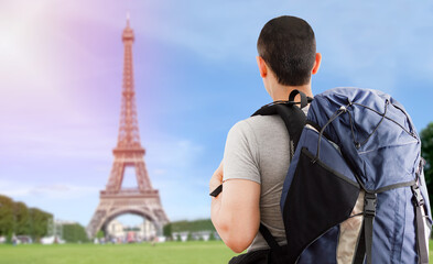 Traveler boy in europe and looking at the Eiffel Tower in France with backpack and back © cunaplus