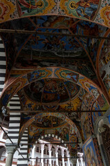 Fototapeta na wymiar Paintings of the Rila Monastery in Bulgaria, on a cloudy day without tourists.