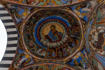 Fototapeta na wymiar Paintings of the Rila Monastery in Bulgaria, on a cloudy day without tourists.