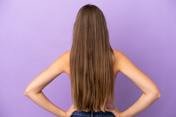 Obraz premium Young Lithuanian woman isolated on purple background in back position