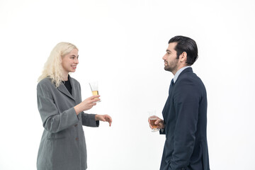 Businessman and businesswoman  wearing suit holding a glass of champagne to celebrate success of investment agreement after meeting, teamwork and partnership concept on white background.