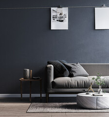 living room with a grey sofa and a center table with two pictures on it.