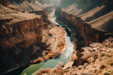 Aireal top view of a river flowing through a canyon surrounded by majestic mountains created with Generative AI technology - obrazy, fototapety, plakaty