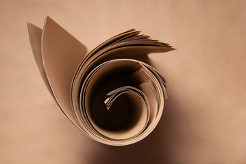 A roll of kraft ecological paper, top view. Kraft paper for packaging and printing on it