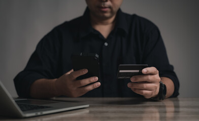 Concept e banking or e commerce : business man using his Laptop for payment by wallet app technology or digital money transfer after his shopping something by application .	
