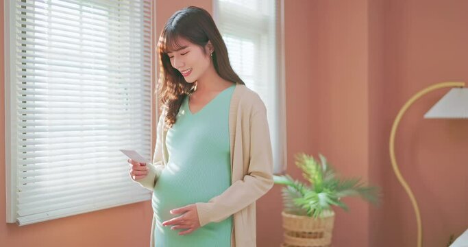 asia woman pregnant see ultrasound