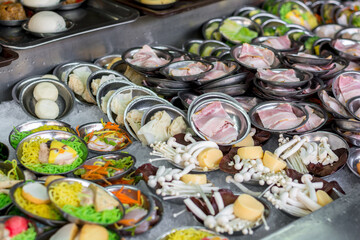 Street Chinese appetizer. Variety of dumplings or dim sum on the small metal plate.