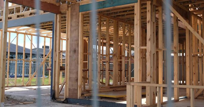The wooden structure frame of a new residential house in a construction site. Concept of self build home, real estate development and property ownership. Melbourne VIC Australia