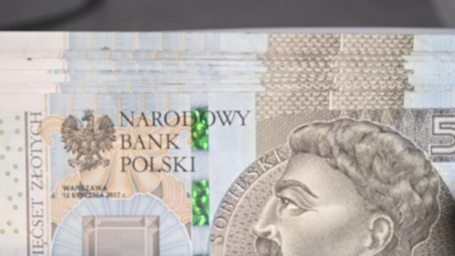 Polish Banknotes Going Through Cash Counter Machine