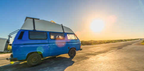 Transporter Camping Van bus at the California Ocean in the coastal Nature