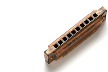 Old retro harmonica white background.