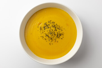 Sweet pumpkin soup on a white background