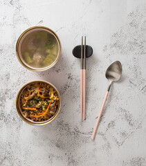 Stainless steel tableware and kitchen utensils placed on the desktop