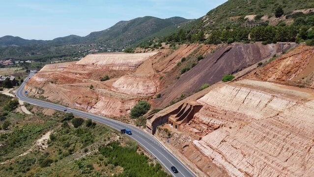 monteponi mine - aerial view of the red mud and the ruins of the old monteponi mine in Iglesias in southern Sardinia
