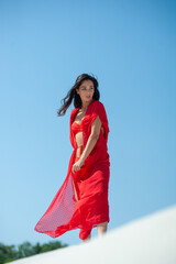 Beautiful woman on white sand wearing beach wear