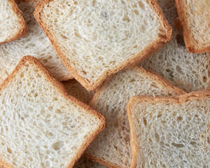 slice of white bread in full frame, popular food item in many cultures and used for making...