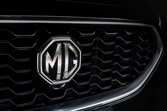 nice MG ZS luxury black and chromium grille with mg logo of black MG zs model in the dark black garage background at night