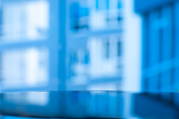 Captivating Urban Advertising: Vivid Reflection on Glossy Surface Amidst Multistory Cityscape