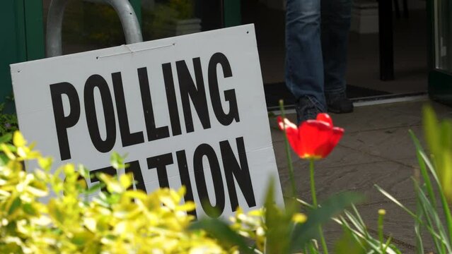 Polling staton with people exiting after voting