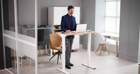 Adjustable Height Desk Stand In Office