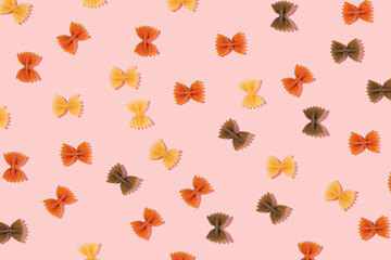 Pattern made of pasta on a pink background. Flat lay