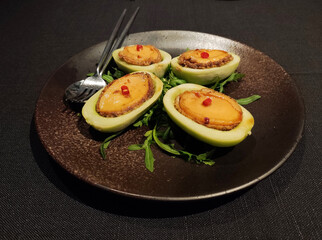 fresh braised abalone on the cucumber on the plate ready for eating