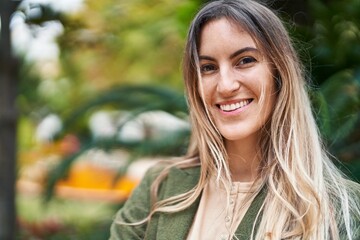 Young woman smiline confident standing at park