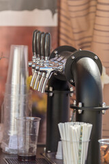 Handmade beer faucet. Bar counter in a pub with a beer tap, side view. The concept of buying, selling and drinking beer.