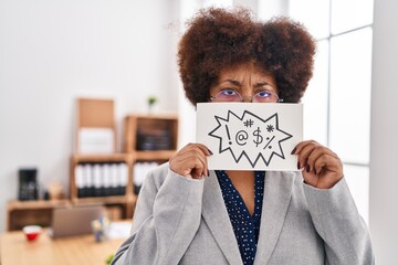 African american woman business worker holding shout message banner at office